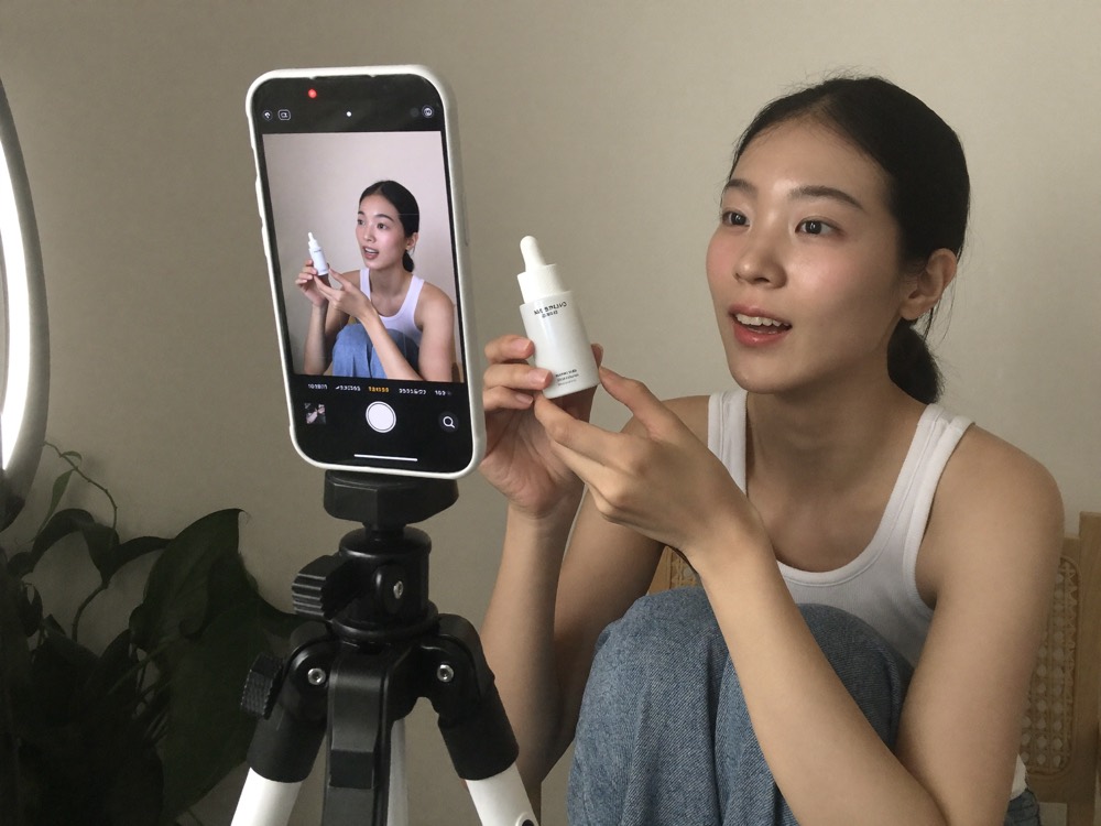 A creator filming a review of the product